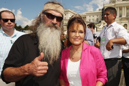 WASHINGTON, DC - SEPTEMBER 09: Reality television personality Phil Robertson (L) and Sarah Palin pose for photographs during a rally against the Iran nuclear deal on the West Lawn of the U.S. Capitol September 9, 2015 in Washington, DC. Thousands of people gathered for the rally, organized by the Tea Party Patriots, which featured conservative pundits and politicians. (Photo by Chip Somodevilla/Getty Images)