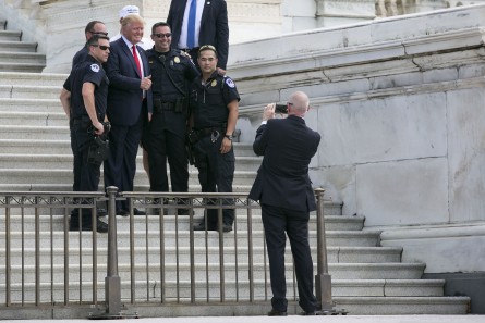 UNITED STATES - September 9: Republican presidential candidate Donald Trump takes a photo with members of the Capitol Police after a rally organized by Tea Party Patriots on Capitol Hill in Washington, Wednesday, Sept. 9, 2015, to oppose the Iran nuclear agreement. (Photo By Al Drago/CQ Roll Call)