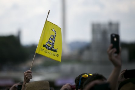 UNITED STATES - A rally attendee waves a flag during a rally organized by Tea Party Patriots on Capitol Hill in Washington, Wednesday, Sept. 9, 2015, to oppose the Iran nuclear agreement. (Photo By Al Drago/CQ Roll Call)