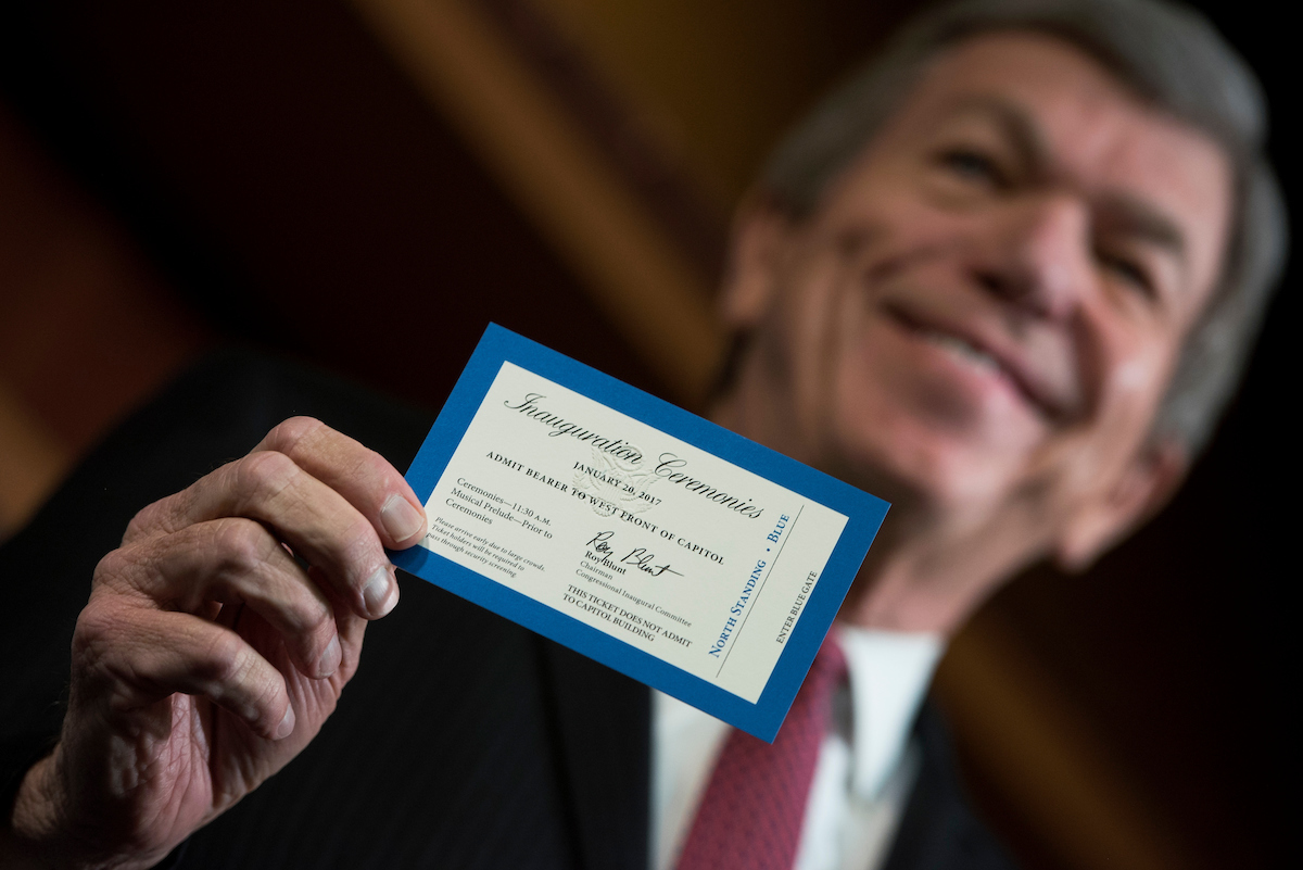 Missouri Sen. <a class="memberLink" title="Click to view member info in a new window" href="http://data.rollcall.com/members/274?rel=memberLink" target="_blank">Roy Blunt</a> reveals the ticket for Inauguration Day at a news conference on Thursday. (Tom Williams/CQ Roll Call)