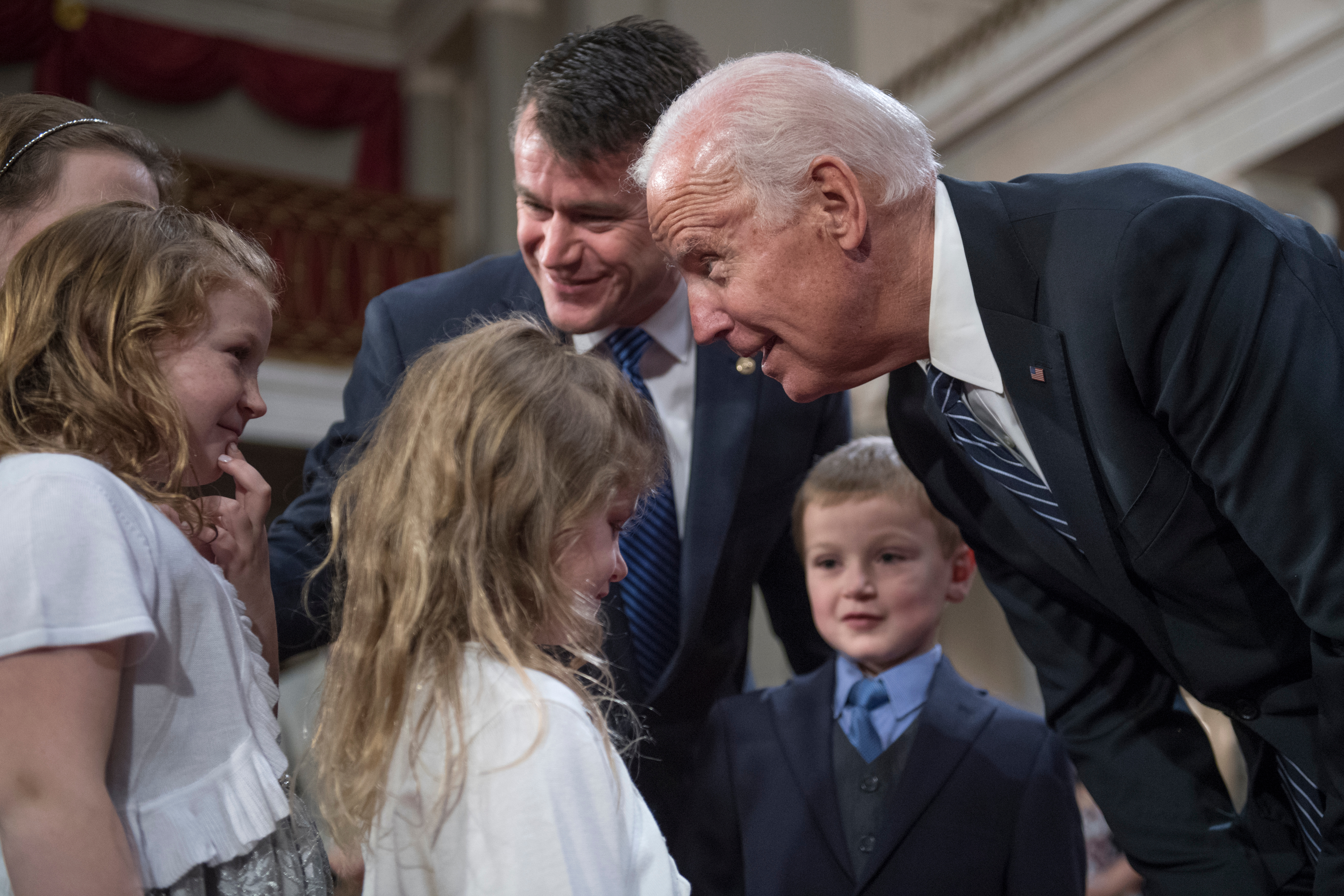 Vice President Joseph R. Biden Jr., right, talks with Young and his children during his swearing-in ceremony on Jan. 3. (Tom Williams/CQ Roll Call)