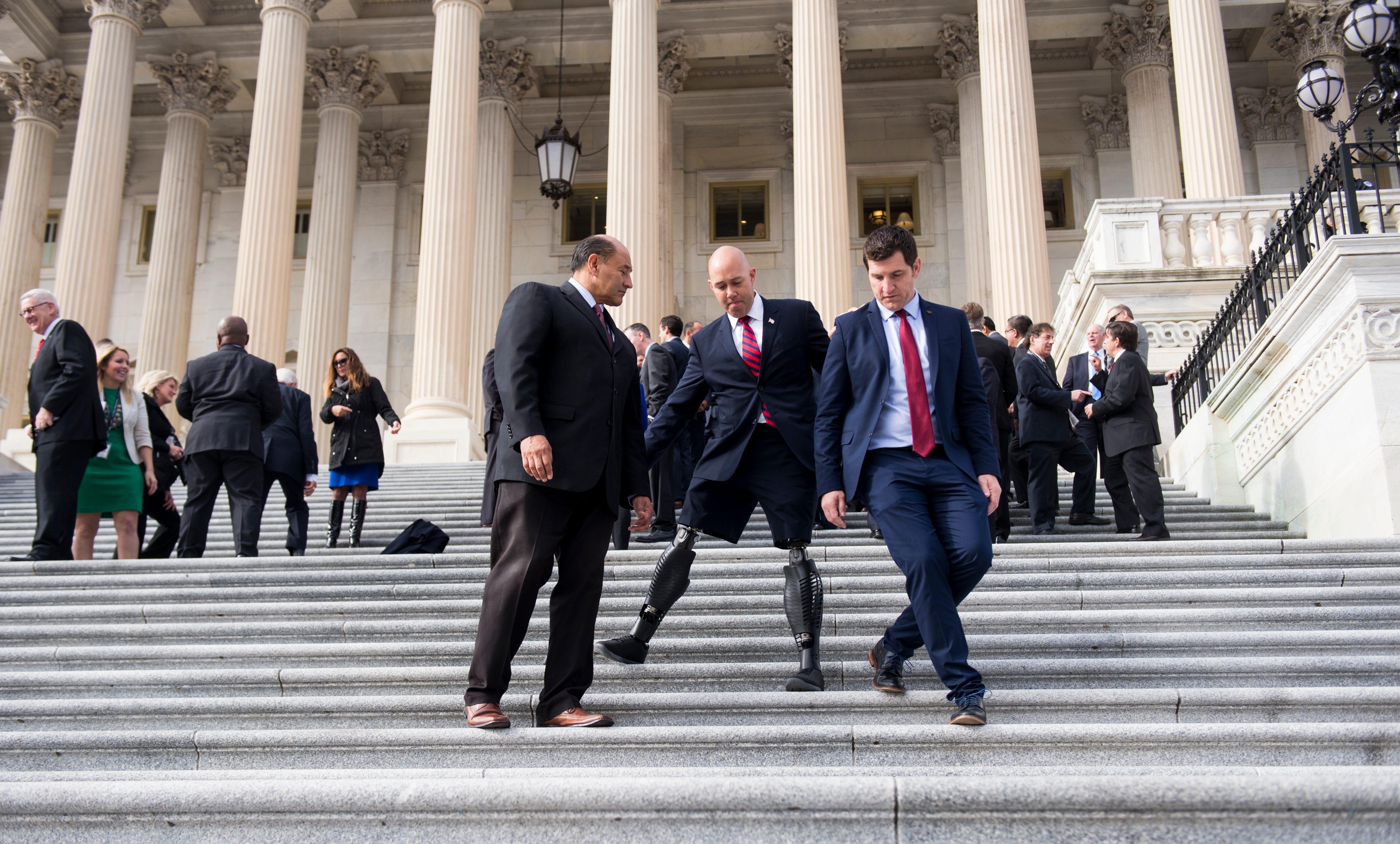 Mast counts many House Republicans among his friends in Congress, including Virginia Rep. Scott Taylor, right. Also seen in the photo from last year’s freshman orientation is California Rep. Lou Correa. (Bill Clark/CQ Roll Call file photo)