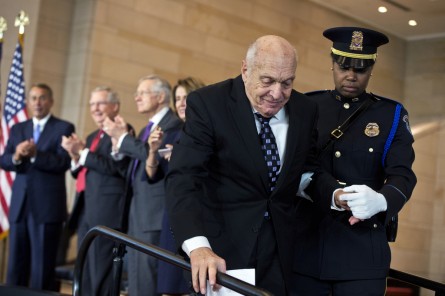 Harry Ettlinger, one World War II's "Monuments Men," is escorted off the stage after making remarks during a Congressional Gold Medal ceremony in honor of the group in the Capitol Visitor Center's Emancipation Hall, October 22, 2015. Ettlinger served as a translator for the Monuments Men, a division that tracked down looted artwork, during World War II. Appearing from left are, Speaker John Boehner, R-Ohio, Senate Majority Leader Mitch McConnell, R-Ky., Senate Minority Leader Harry Reid, D-Nev., and House Minority Leader Nancy Pelosi, D-Calif.