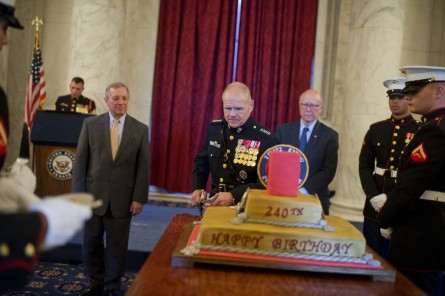 Neller cuts the cake as Roberts, right, looks on. (Tom Williams/CQ Roll Call)