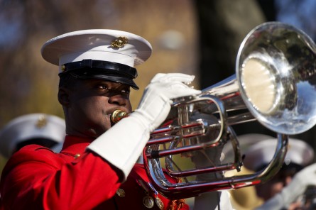 UNITED STATES - NOVEMBER 11: A member of the U.S. Marine Drum & Bugle Corps plays during at a Veteran's Day ceremony in Folger Park on Capitol Hill hosted by the American Legion Post 8, November 11, 2014. (Photo By Tom Williams/CQ Roll Call)