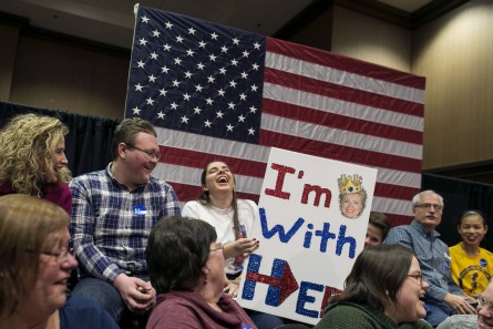 UNITED STATES - JANUARY 20 - Kayla Kaminski, from Dallas City, Ill., laughs as she waits with her homemade sign and shirt to see Democratic presidential candidate Hillary Clinton speak at an organizing event, Wednesday, Jan. 20, 2016, in Burlington, Iowa. (Photo By Al Drago/CQ Roll Call)