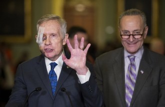 Schumer, right, says the GOP is forcing Democrats to negotiate with a gun to their heads. (Bill Clark/CQ Roll Call File Photo)