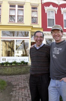 Father and son co-owners Steve, left, and Paul Cymrot in earlier times in front of Riverby Books on East Capitol Street. (CQ Roll Call File Photo)