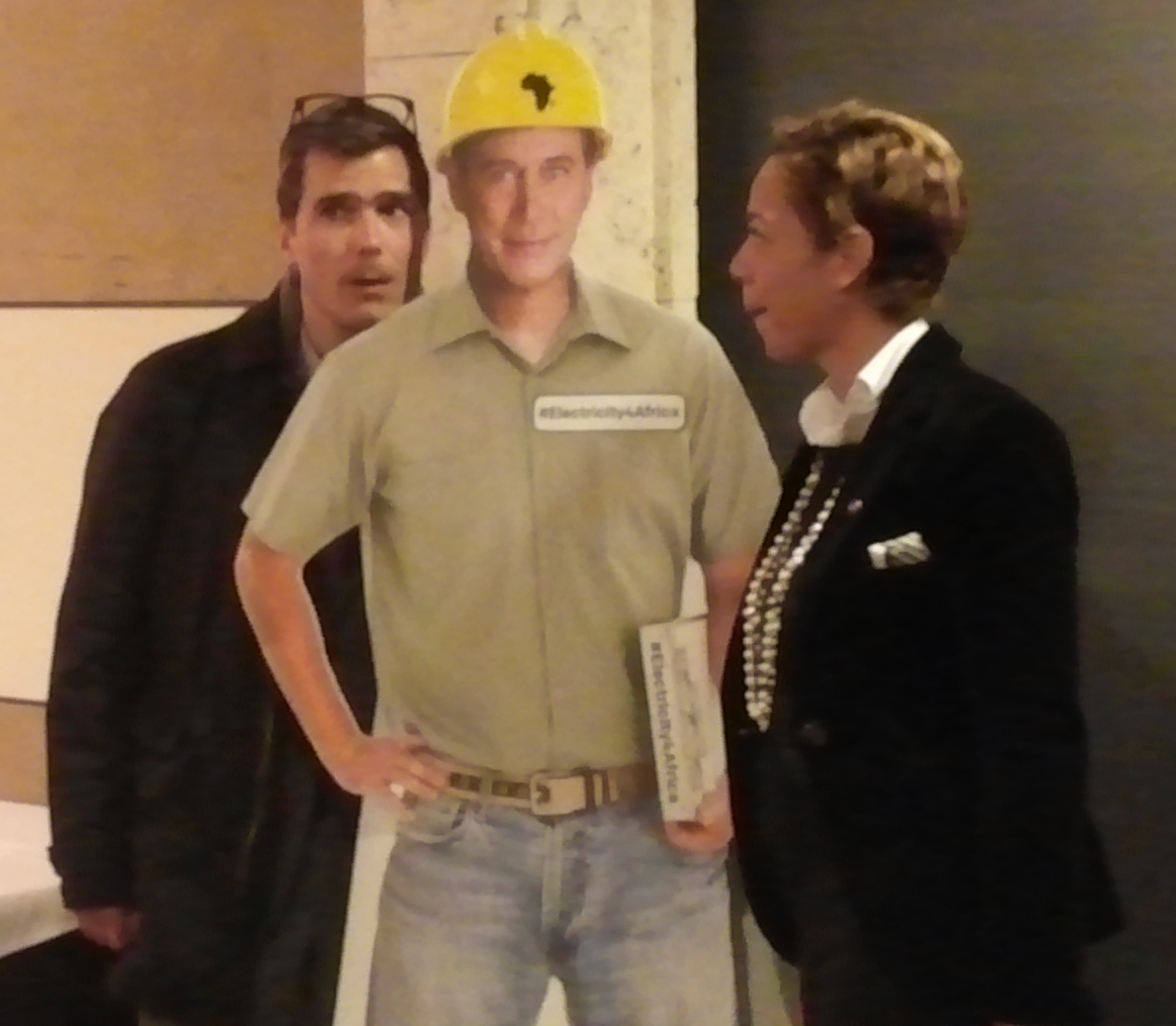 Top Chef judge Hugh Acheson and Top Chef alumna Nina Compton clown around with a cardboard cut out of House Speaker John Boehner after a ONE.org luncheon.