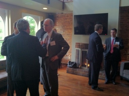 Foster, center, chats with business advocates Thursday evening. (Julie Ershadi/CQ Roll Call)