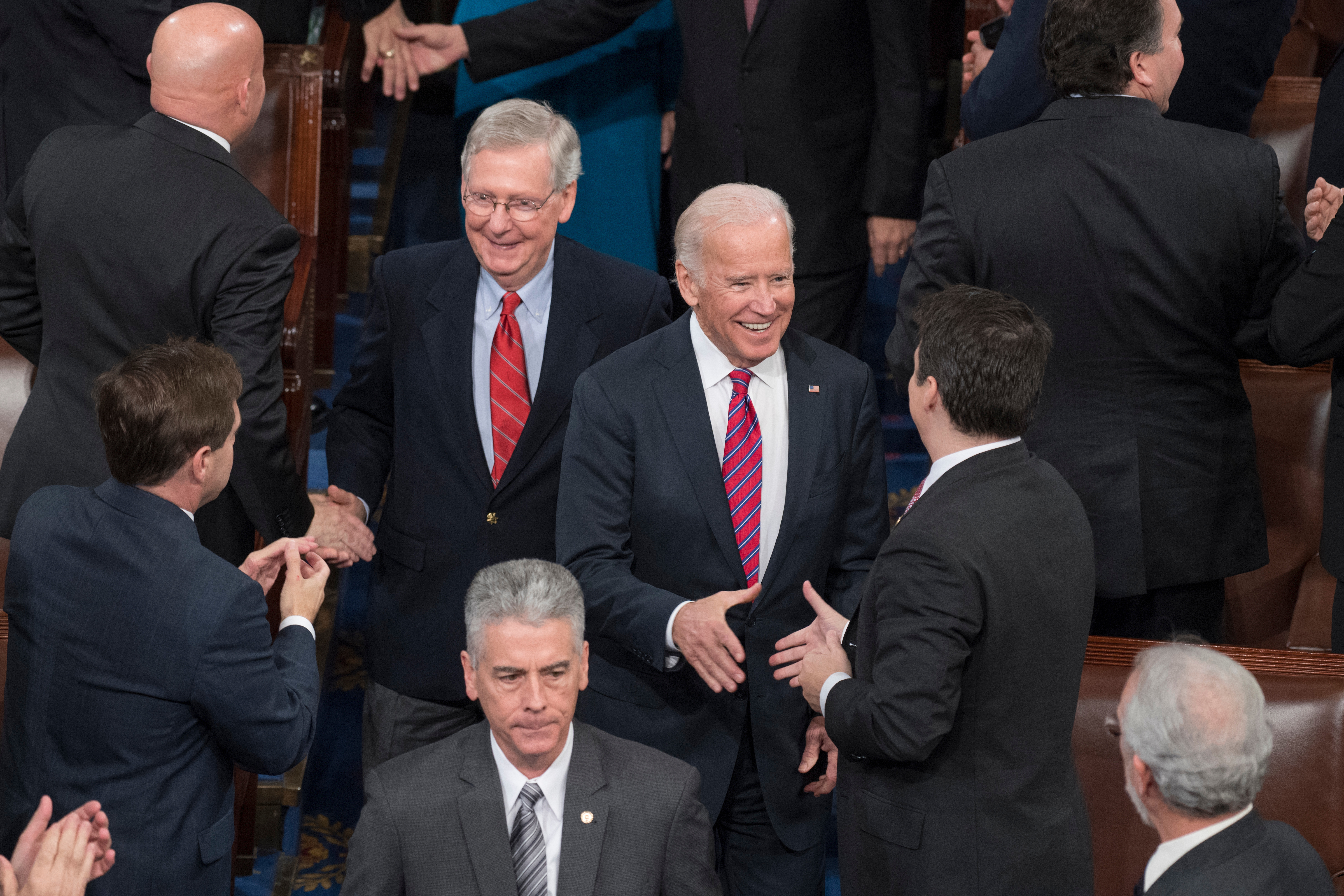 Biden and Senate Majority Leader Mitch McConnell arrive in the House chamber for a joint session of Congress to tally the Electoral College votes for president and vice president on Friday. (Tom Williams/CQ Roll Call)