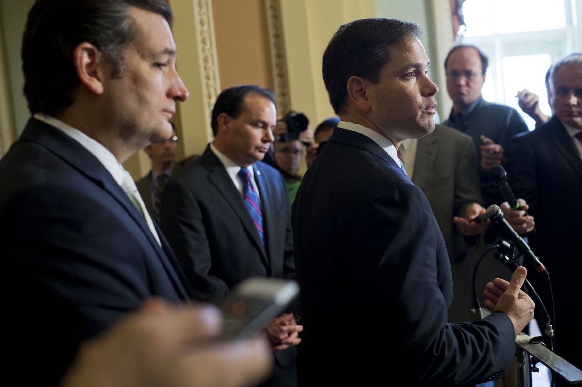 UNITED STATES - SEPTEMBER 27: From left, Sens. Ted Cruz, R-Texas, Mike Lee, R-Utah, and Marco Rubio, R-Fla., speak to the media after the Senate voted to pass the continuing resolution. (Photo By Tom Williams/CQ Roll Call)