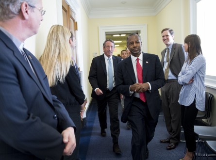 Sanford, center left, escorts his guest Ben Carson to the House chamber for Pope Francis' speech to a joint meeting of Congress on Sept. 24, 2015. (Photo By Bill Clark/CQ Roll Call File Photo)